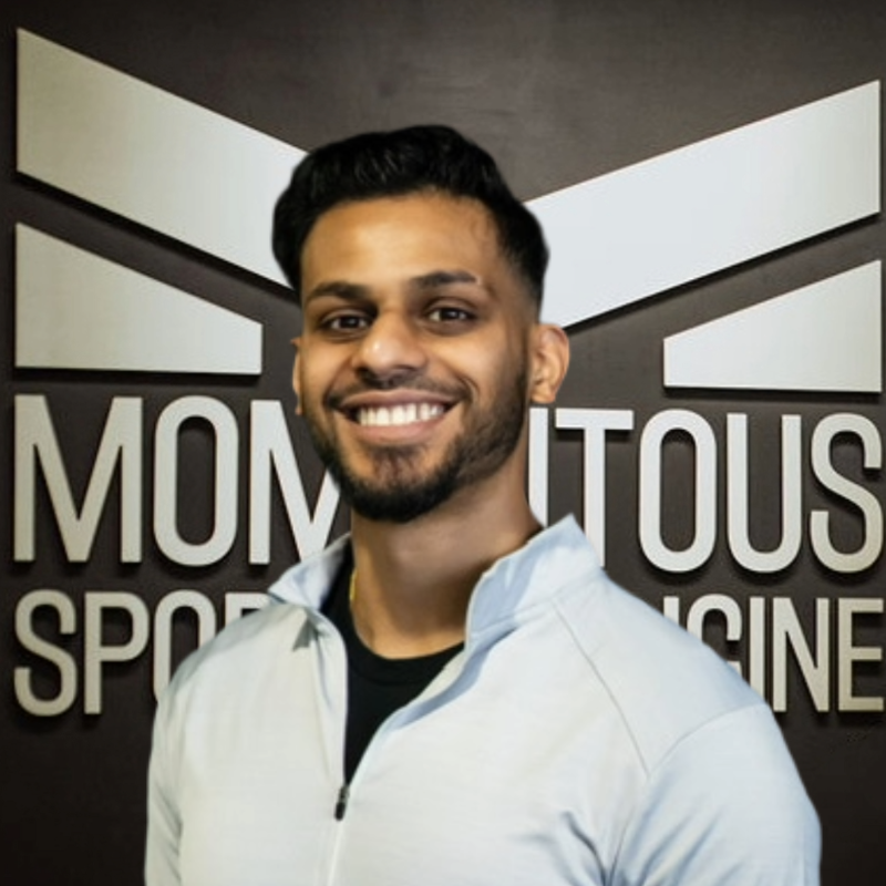 Picture of Norfolk State University Physical Therapist Neil Sheth with Momentous Sports Medicine logo in background
